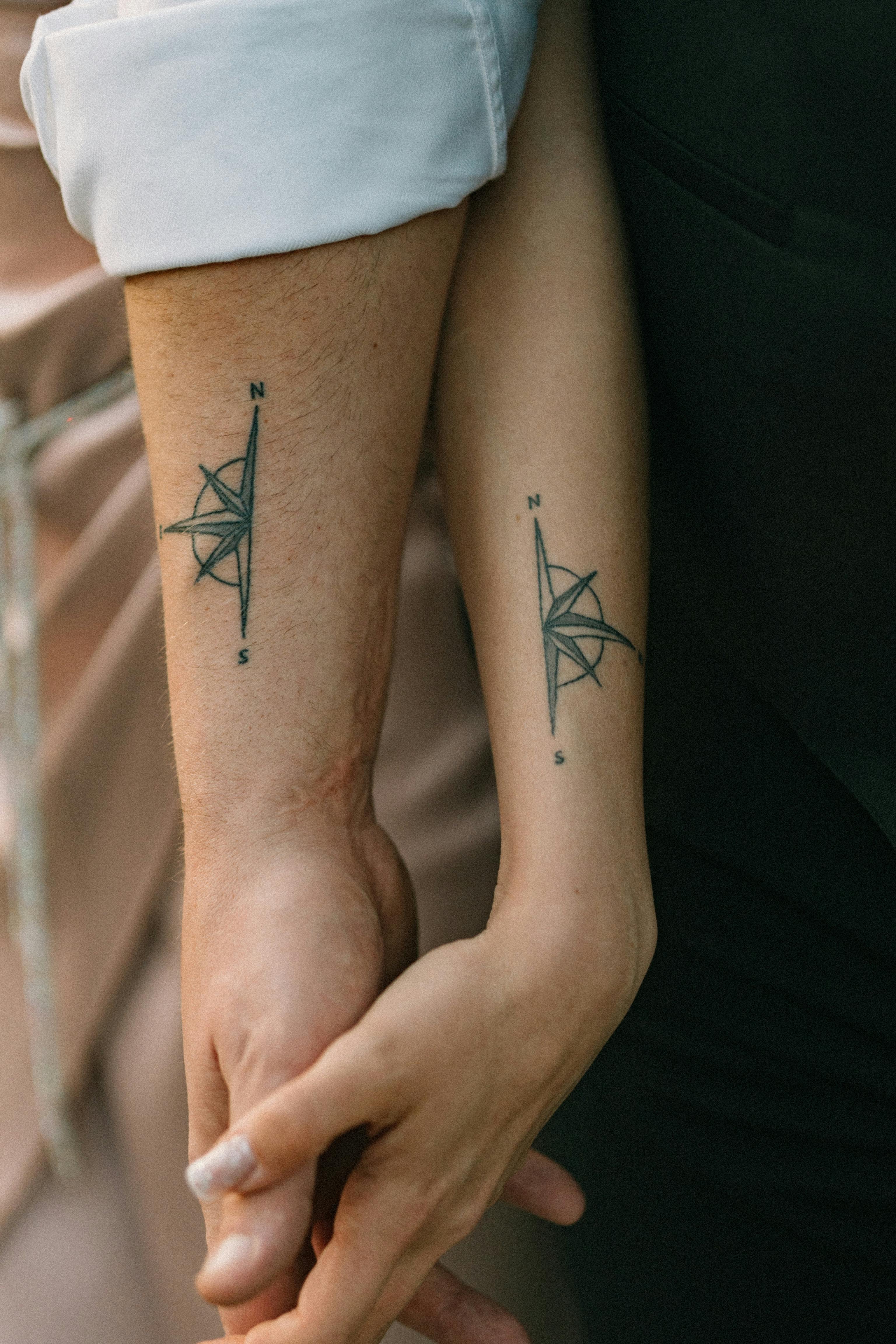 Matching compass tattoos — Fine Line