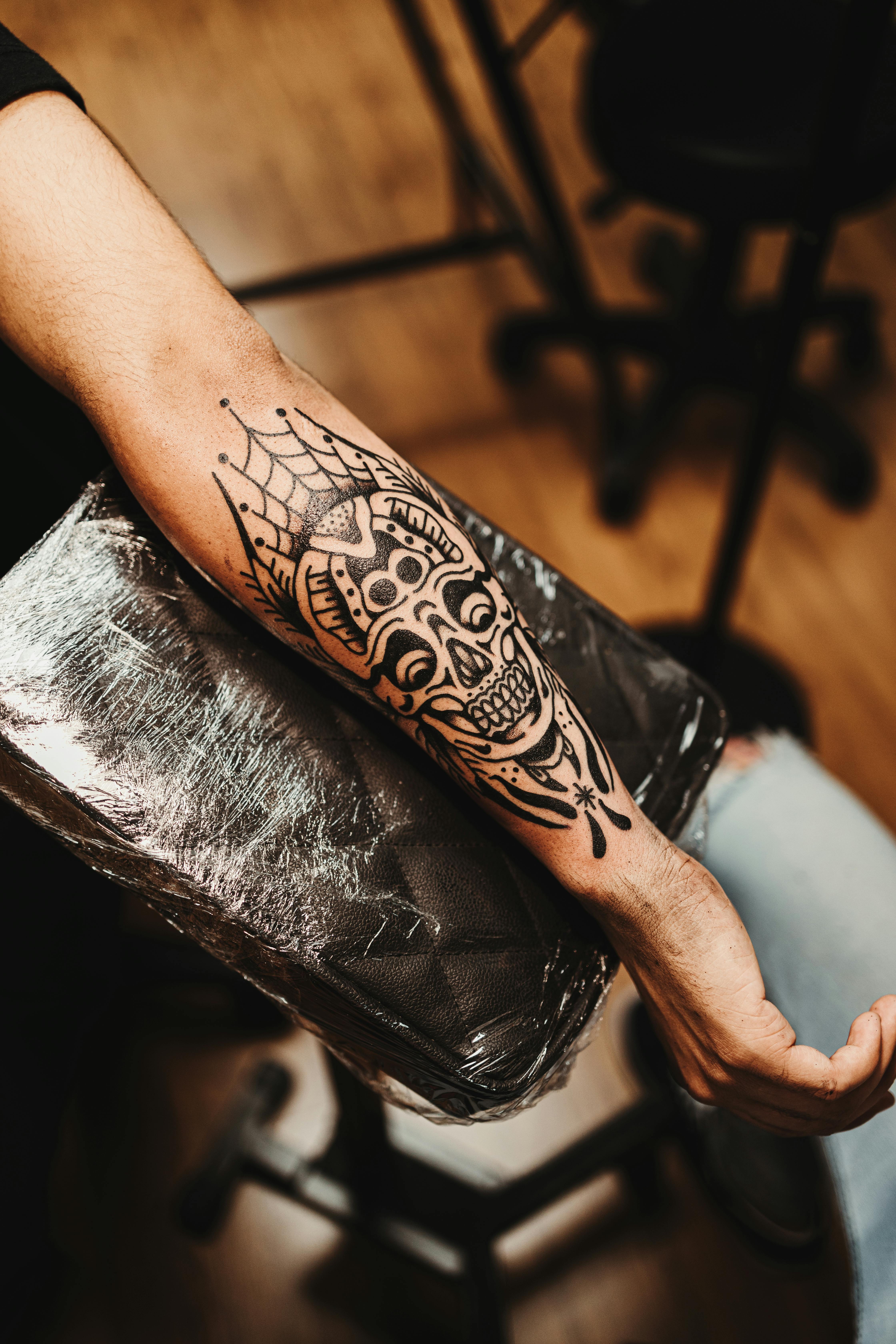 Traditional skull tattoo by Jake Moreno
